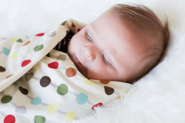 When to stop swaddling your baby