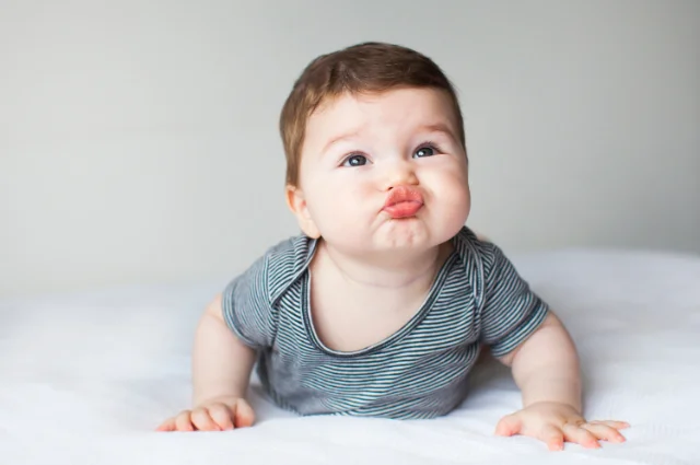 When do babies give kisses